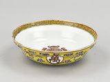 an image of a yellow and white bowl sitting on top of a table