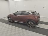 2020 nissan cx - hr in a garage with a black and white checkered floor