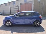 a blue car that is parked in a parking lot