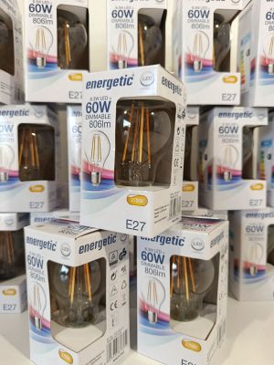 several boxes of electric light bulbs stacked on top of each other