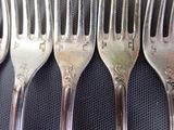 five forks that are sitting on top of each other