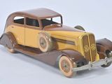 a toy car that is sitting on a white surface