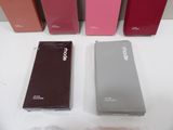 several different colors of cell phones are lined up on a table