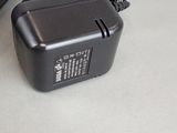 an image of a charger and a power cord on a table