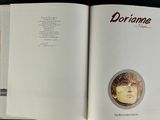 an open book with a picture of a man ' s face on it