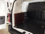 a white van with a wooden panel in the back of it