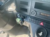 a car dashboard with a clock and a car key in it