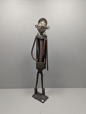 statue of a man in a suit with a hat on his head