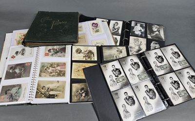 an image of a collection of old photographs and a book on a table