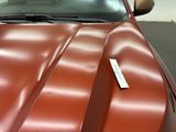 an image of a red car with a price tag on it
