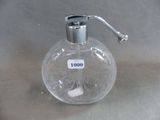 a clear glass bottle with a liquid dispenser on it