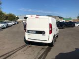a white van that is parked in a parking lot