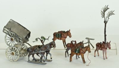 a lot of figurines of horses pulling a carriage