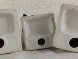 two white porcelain sinks sitting next to each other on a table