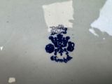 a white plate with a blue and white design on it