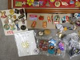 a picture of a collection of pins and brooches in a picture frame