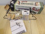 a sewing kit sitting on a table next to a box