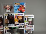 a bunch of pop vinyl figures in a display case