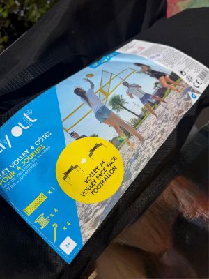 a bag with a sticker on it sitting on a bench