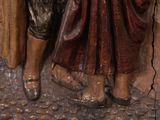 a statue of a man and a woman standing next to each other