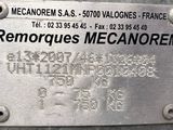 a metal sign that says renoques mecanorem on the side of a building