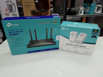 the box of the router is sitting on the table next to the box of the router