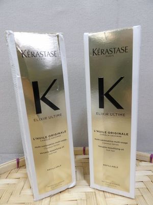 two bottles of kerastasee ultimate kerattasee hair oil