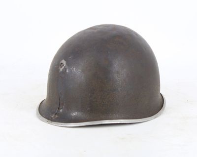 a helmet that is sitting on a white surface