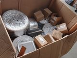 a cardboard box full of duct tape and other items