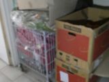 many boxes stacked on a cart in a room