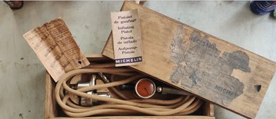 a wooden box with a bunch of electrical cords in it