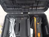 a tool case with tools inside of it on the ground