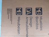 a cardboard box with three different signs on it