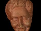 a close up of a clay bust of a man