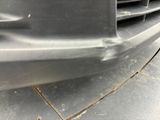 a close up of a car ' s front bumper