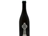 a bottle of wine with a celtic design on it