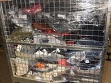 a metal cart with many items in it in a warehouse