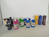 many different colors of paint on the table