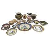 many different types of plates and bowls on the table