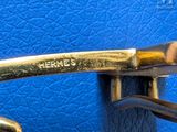 a close up of a pair of scissors on a blue surface