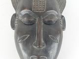 an image of a metal mask on a white background