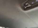 a close up of a car ' s dashboard with a remote control