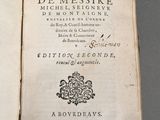 an open book with a black and white image of the title of a poem