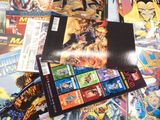 a lot of comic books on the table together