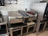 a kitchen with a lot of appliances in it