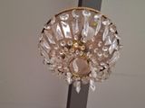 a chandelier hanging from the ceiling in a room