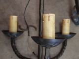 a candle holder that has four candles on it
