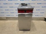 an image of a silver and red oven sitting on top of a floor
