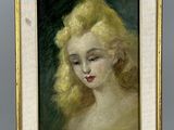 un tableau représentant une femme aux cheveux blonds, dans un cadre doré