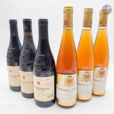 six bouteilles de vin sont alignées sur une surface blanche